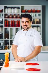 Photograph of Sylvain in his kitchen