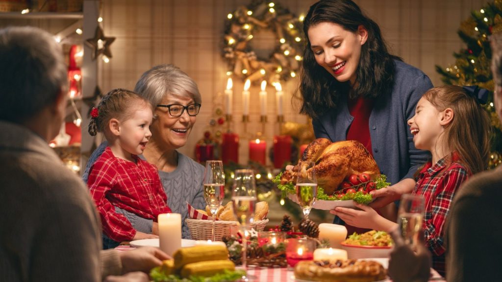 Family enjoying a traditional Christmas dinner for ostomates